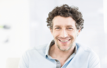 zeramex_patient_1.1_510x325px Patient with curly dark hair laughs